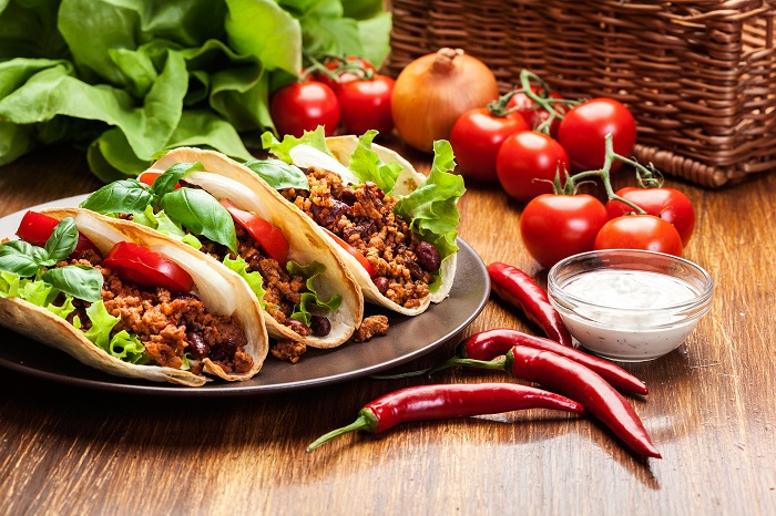 Mexican tacos with minced meat, beans and spices